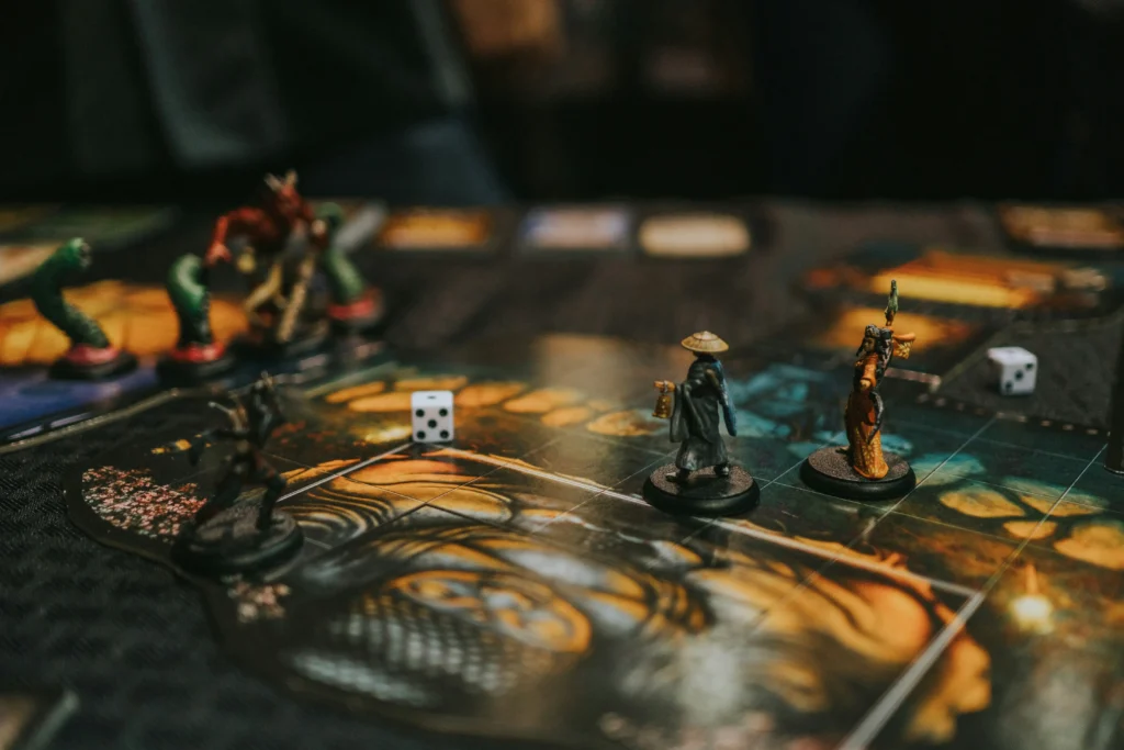 Dungeons & Dragons tabletop game with miniatures, dice, and map board during gameplay.